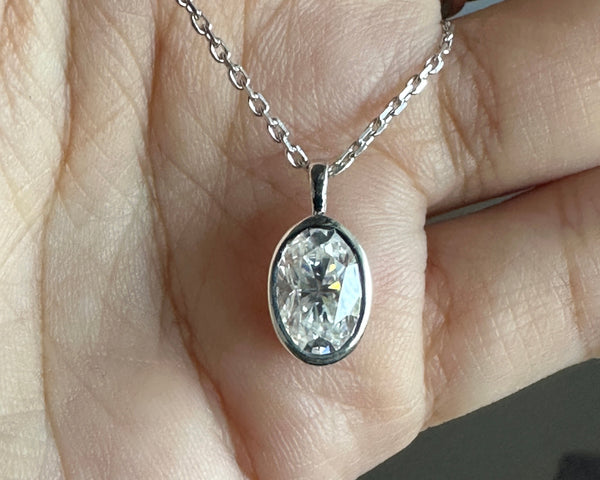 Bezel Set 2 Carat Oval Cut Moissanite Solitaire Pendant Necklace in Solid Gold